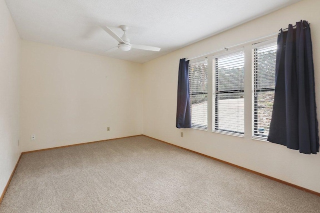21009 Fawn Ridge Dr, Lago Vista, TX 78645 - unfurnished room with baseboards, a ceiling fan, and carpet