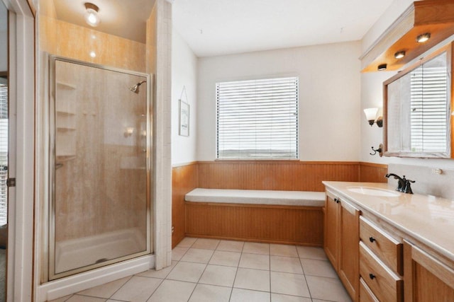 21009 Fawn Ridge Dr, Lago Vista, TX 78645 - full bath with vanity, a wainscoted wall, tile patterned floors, and a stall shower