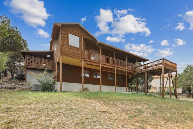 21009 Fawn Ridge Dr, Lago Vista, TX 78645 - rear view of property with a wooden deck, a lawn, and cooling unit
