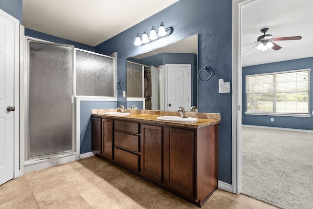 6060 County Road 3300, Kempner, TX 76539 - full bath with double vanity, a ceiling fan, a stall shower, and a sink