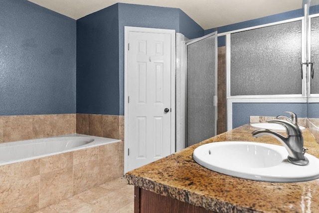 6060 County Road 3300, Kempner, TX 76539 - full bath featuring a shower stall, a textured wall, a bath, and a sink