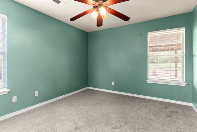6060 County Road 3300, Kempner, TX 76539 - empty room with plenty of natural light, carpet flooring, and ceiling fan