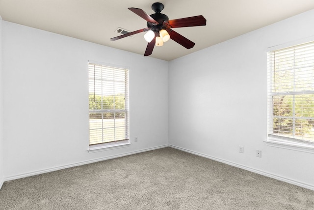 6060 County Road 3300, Kempner, TX 76539 - carpeted spare room with baseboards, visible vents, ceiling fan, and a healthy amount of sunlight