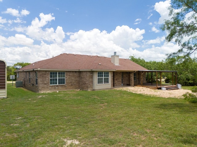 6060 County Road 3300, Kempner, TX 76539 - rear view of house with brick siding, central air condition unit, a lawn, and a chimney