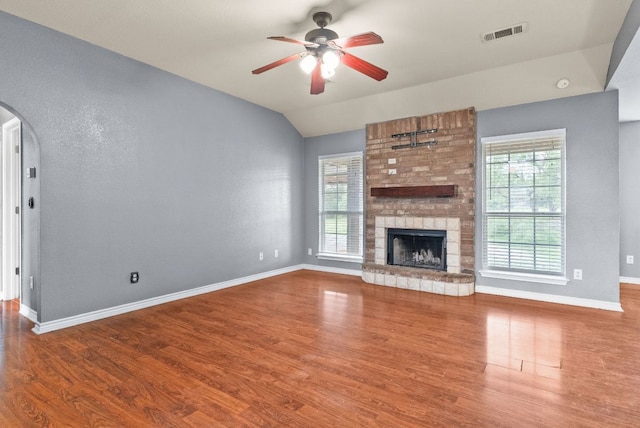 6060 County Road 3300, Kempner, TX 76539 - unfurnished living room with a ceiling fan, wood finished floors, arched walkways, baseboards, and visible vents
