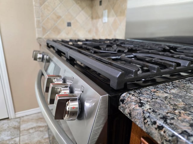 4125 Autumnwood Trl, San Angelo, TX 76904 - detailed view of stainless steel gas range oven and tasteful backsplash