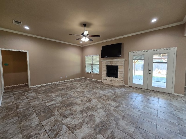 4125 Autumnwood Trl, San Angelo, TX 76904 - unfurnished living room featuring a ceiling fan, healthy amount of natural light, crown molding, a stone fireplace, and baseboards