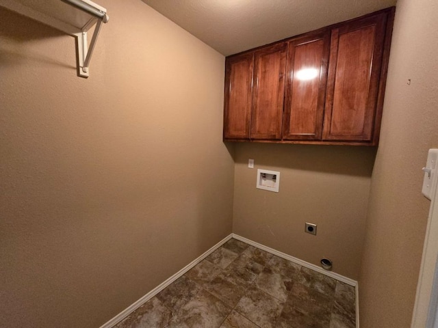 clothes washing area with cabinet space, washer hookup, baseboards, and hookup for an electric dryer