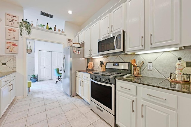 kitchen with white cabinets, tasteful backsplash, visible vents, appliances with stainless steel finishes, and light tile patterned floors
