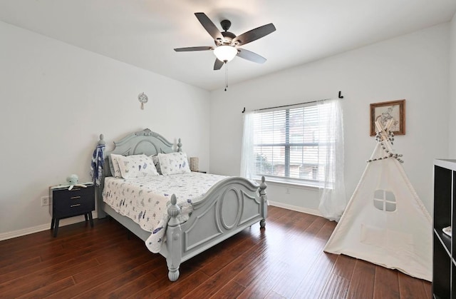 bedroom featuring ceiling fan, baseboards, and dark wood-style flooring