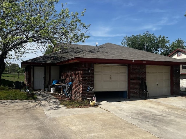 garage featuring driveway