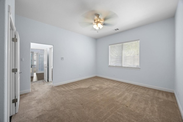 unfurnished bedroom featuring carpet floors and baseboards