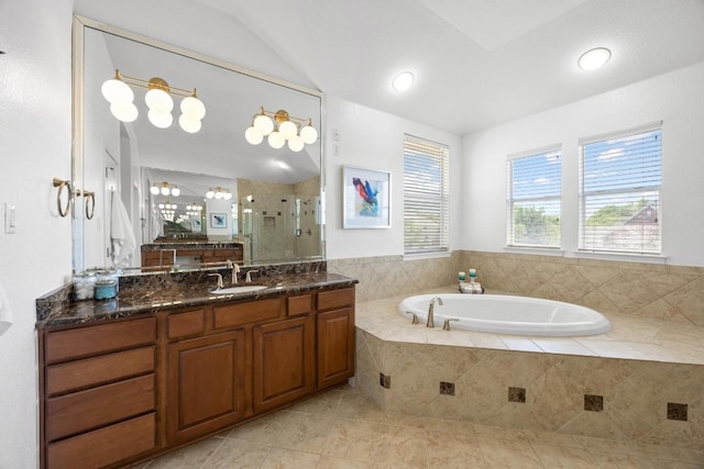 full bath featuring a shower stall, vanity, a bath, tile patterned flooring, and lofted ceiling