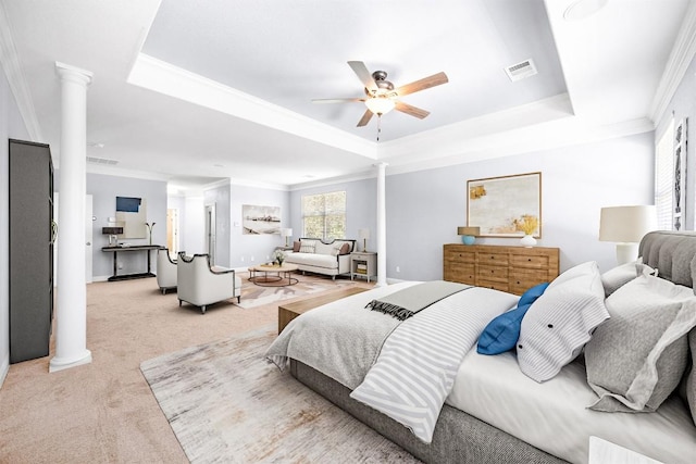 bedroom featuring decorative columns, a tray ceiling, ornamental molding, carpet floors, and baseboards