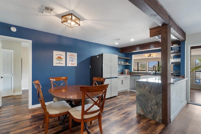 67 Augusta Dr, Wimberley, TX 78676 - dining room featuring dark wood finished floors, baseboards, recessed lighting, and beamed ceiling