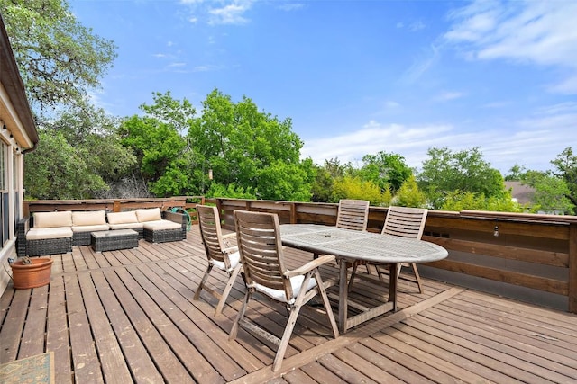 67 Augusta Dr, Wimberley, TX 78676 - wooden terrace featuring outdoor lounge area, outdoor dining area, and view of scattered trees
