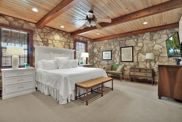 carpeted bedroom featuring beamed ceiling and wooden ceiling