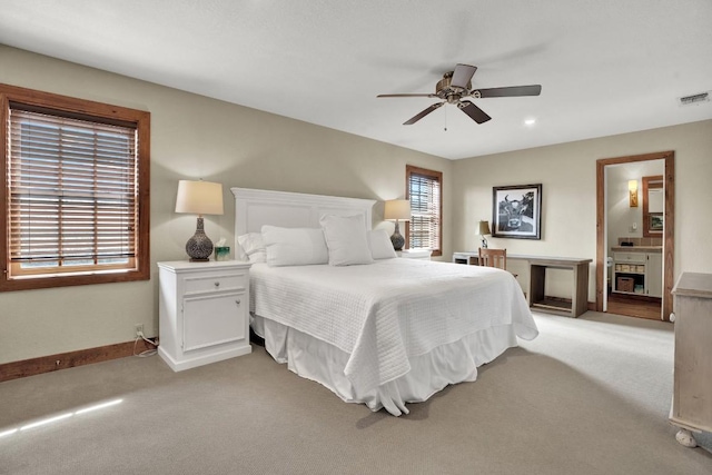 bedroom featuring ceiling fan, visible vents, baseboards, and light carpet