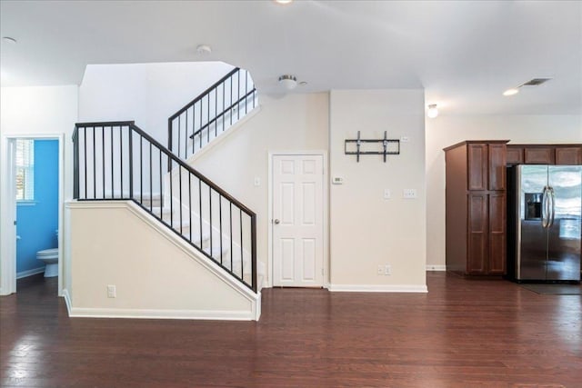 608 Lookout Tree Ln, Round Rock, TX 78664 - stairway featuring wood finished floors, visible vents, and baseboards