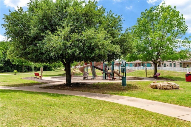 608 Lookout Tree Ln, Round Rock, TX 78664 - view of community featuring a lawn, fence, and playground community