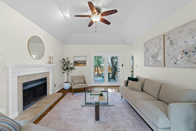 3614 Serena Woods Ct, Austin, TX 78759 - living area with vaulted ceiling, wood finished floors, ceiling fan, a fireplace, and baseboards