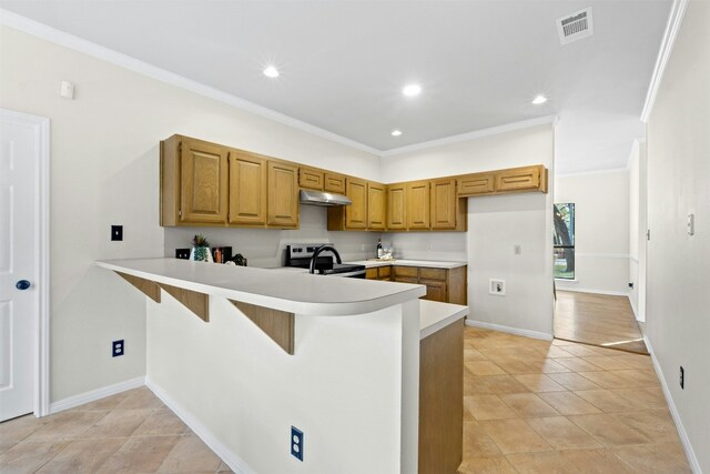 3614 Serena Woods Ct, Austin, TX 78759 - kitchen with a peninsula, stainless steel range with electric cooktop, visible vents, light countertops, and under cabinet range hood