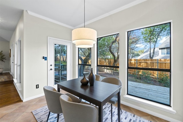 3614 Serena Woods Ct, Austin, TX 78759 - dining area with baseboards, ornamental molding, light tile patterned flooring, and plenty of natural light