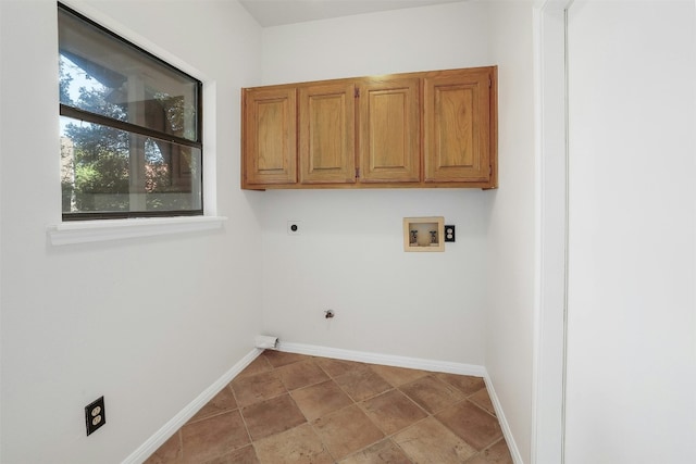 3614 Serena Woods Ct, Austin, TX 78759 - washroom with hookup for an electric dryer, stone finish flooring, baseboards, cabinet space, and washer hookup