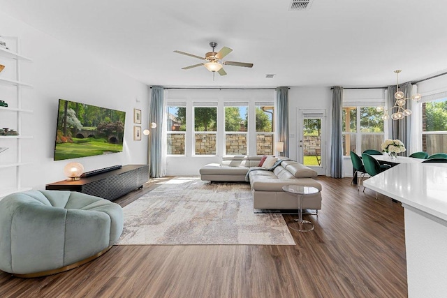 12207 Coronilla Bnd, Austin, TX 78748 - living room with a ceiling fan, dark wood-style flooring, and visible vents