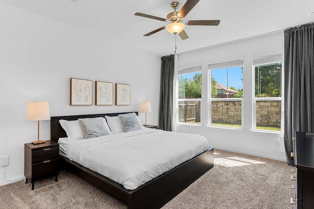 12207 Coronilla Bnd, Austin, TX 78748 - bedroom with carpet flooring, baseboards, and a ceiling fan