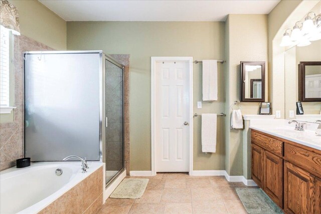 719 Walsh Hill Trl, Cedar Park, TX 78613 - bathroom with a shower stall, a bath, vanity, and tile patterned floors