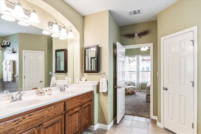 719 Walsh Hill Trl, Cedar Park, TX 78613 - ensuite bathroom featuring double vanity, tile patterned flooring, and baseboards