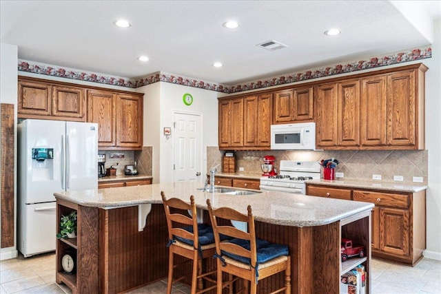 719 Walsh Hill Trl, Cedar Park, TX 78613 - kitchen featuring white appliances, open shelves, a sink, brown cabinetry, and recessed lighting