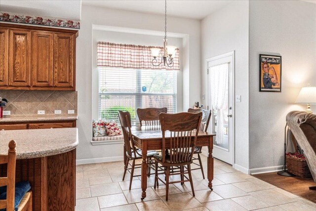 719 Walsh Hill Trl, Cedar Park, TX 78613 - dining space with a chandelier, healthy amount of natural light, and baseboards