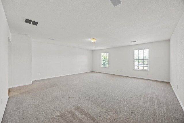 1444 Newbury St, Georgetown, TX 78626 - empty room with carpet flooring and baseboards