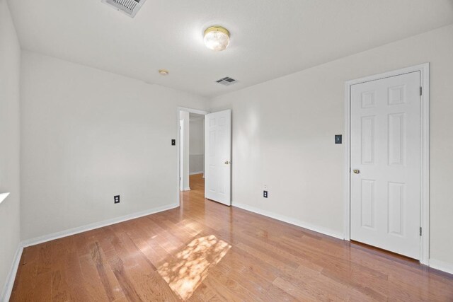 1444 Newbury St, Georgetown, TX 78626 - unfurnished bedroom featuring wood finished floors and baseboards