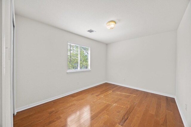 1444 Newbury St, Georgetown, TX 78626 - unfurnished room featuring wood finished floors and baseboards