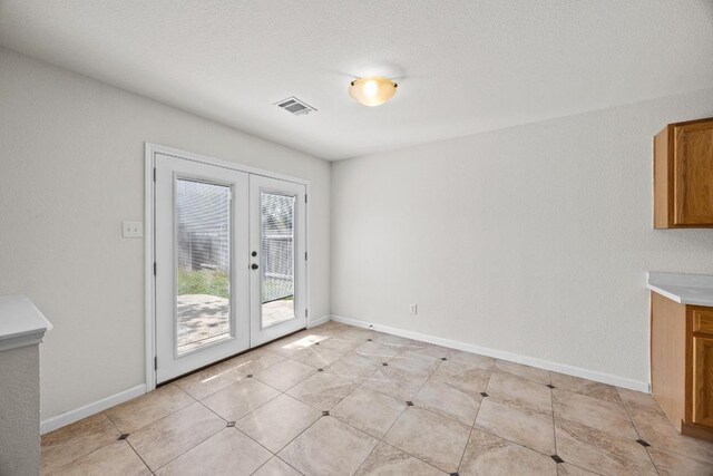 1444 Newbury St, Georgetown, TX 78626 - unfurnished dining area with french doors and baseboards
