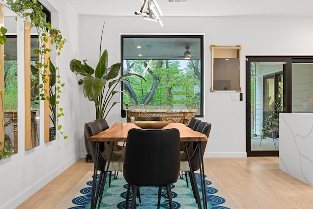 6002 Ponca St Unit 1, Austin, TX 78741 - dining space featuring light wood-style floors and baseboards