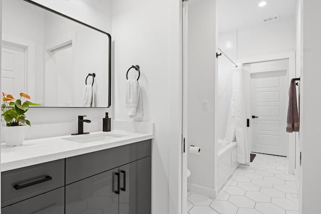 6002 Ponca St Unit 1, Austin, TX 78741 - full bath with vanity, shower / tub combo, and tile patterned flooring