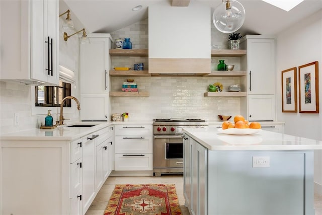 1004 Gaston Ave, Austin, TX 78703 - kitchen with open shelves, luxury stove, a sink, backsplash, and lofted ceiling