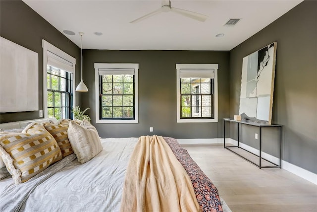 1004 Gaston Ave, Austin, TX 78703 - bedroom featuring light wood-style flooring, baseboards, and a ceiling fan
