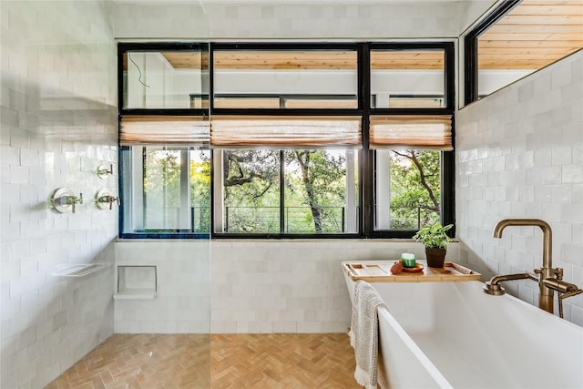 1004 Gaston Ave, Austin, TX 78703 - bathroom featuring tile walls, a sink, and a freestanding bath