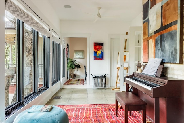 1004 Gaston Ave, Austin, TX 78703 - living area with ceiling fan, light tile patterned flooring, and baseboards
