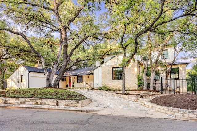 1004 Gaston Ave, Austin, TX 78703 - view of front facade featuring stone siding and a garage