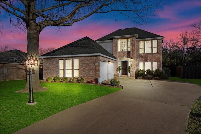 1710 Greening Way, Leander, TX 78641 - traditional home with concrete driveway, brick siding, and an attached garage