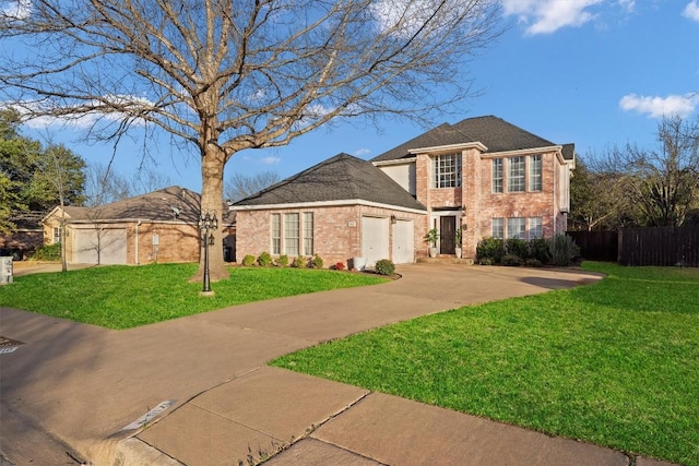 1710 Greening Way, Leander, TX 78641 - view of front of home featuring a garage, brick siding, and driveway