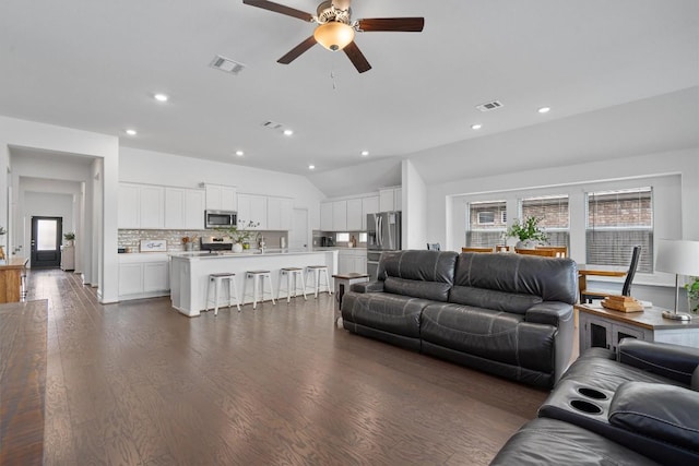 600 Spurlock Way, Liberty Hill, TX 78642 - living area featuring ceiling fan, vaulted ceiling, recessed lighting, and dark wood finished floors