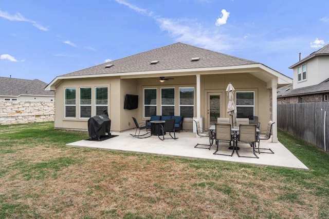 600 Spurlock Way, Liberty Hill, TX 78642 - back of property featuring a ceiling fan, a fenced backyard, stucco siding, and a patio