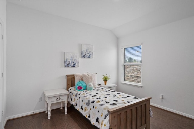 600 Spurlock Way, Liberty Hill, TX 78642 - bedroom with dark wood-style flooring and lofted ceiling